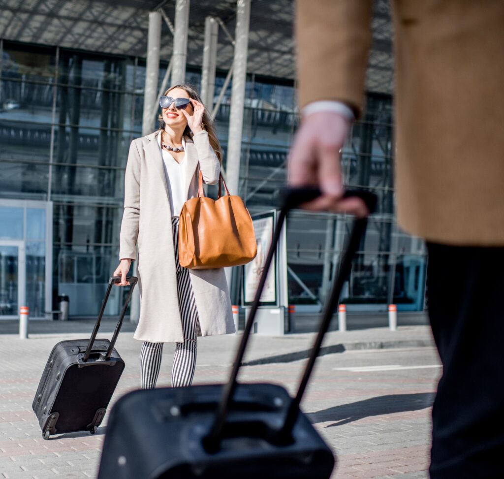Business couple leaving the airport