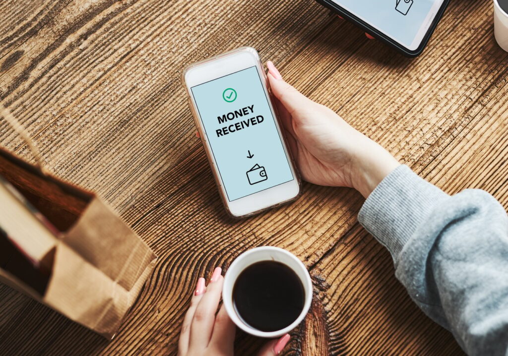 Money transfer. Online banking. People transferring money online using applications on mobile phone